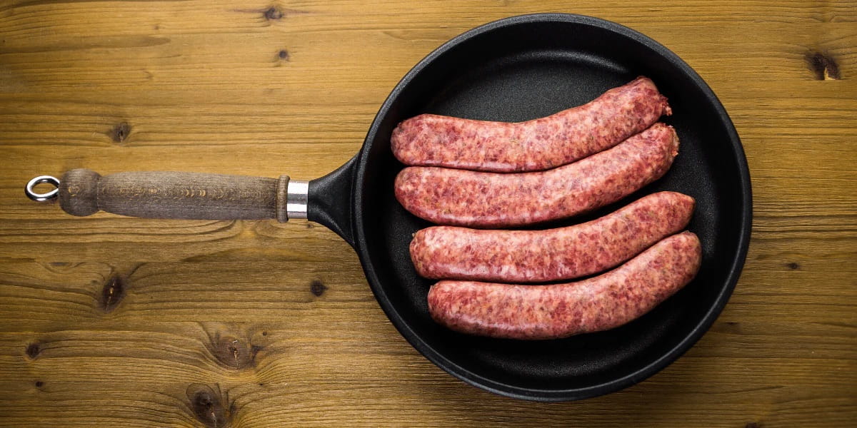 Hot Italian griller sausages in a pan